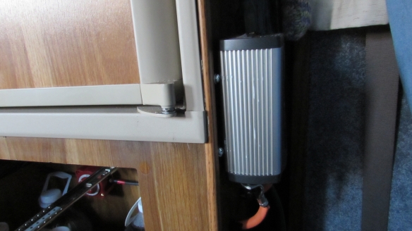 Inverter mounted next to the fridge.